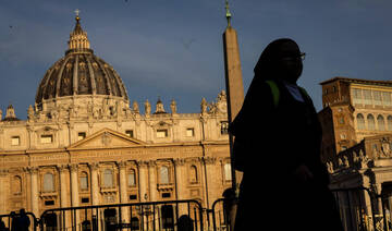 Vatican workers install Sistine Chapel stove where ballots are burned during conclave to elect pope