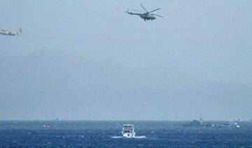 An Egyptian Hercules military aircraft (L) and a helicopter can be seen circling three miles off Sharm El Sheikh. (File/AFP)